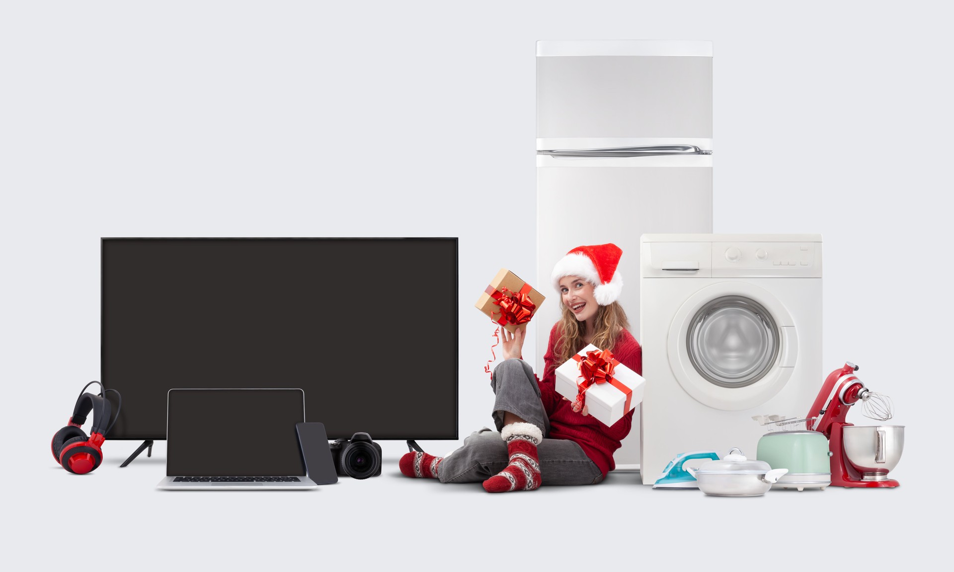Electronics and appliance store Christmas shopping: Smiling woman in a Santa hat holding a Christmas present gift box, Top deals and sales in supermarkets and malls. Xmas online shopping offers banner